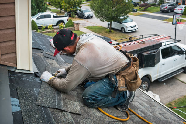 Professional Roofing technician working in Ash, NC